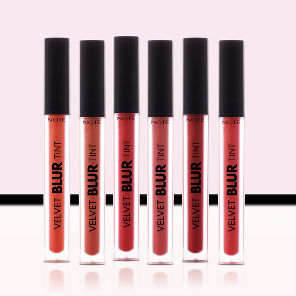 Set of six 'Note Cosmetics Velvet Blur Tint' lip products on a light pink background
